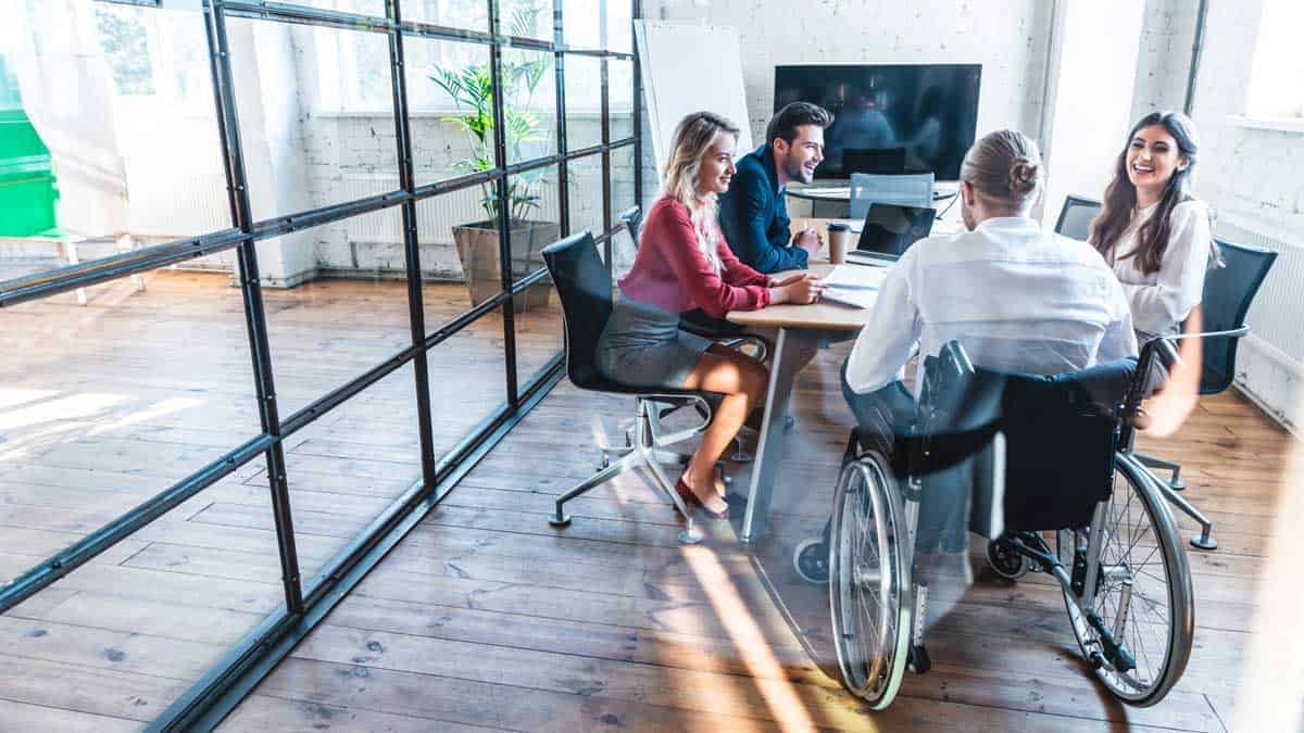 man in wheelchair in a business meeting