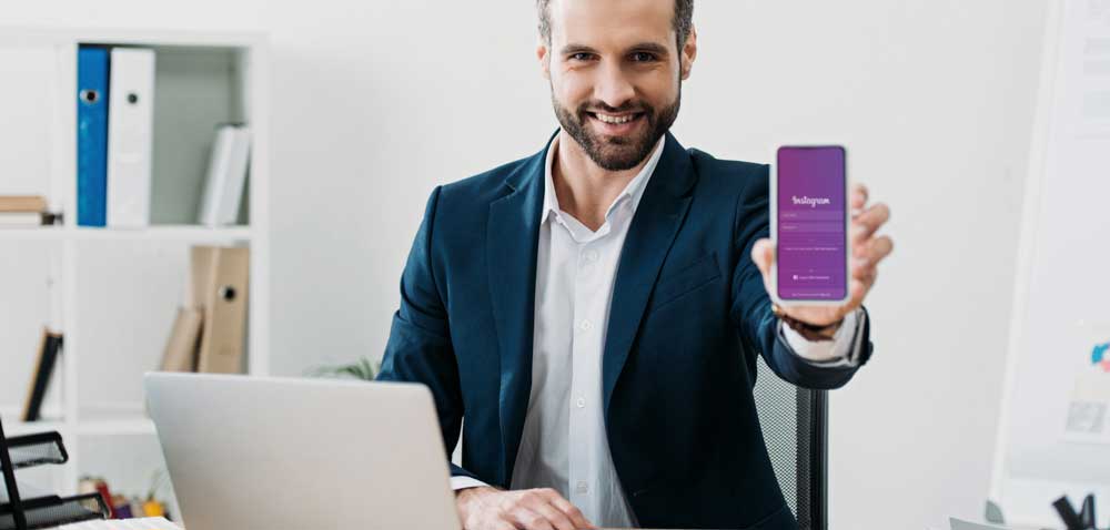 man showing phone with Instagram Shopping app on