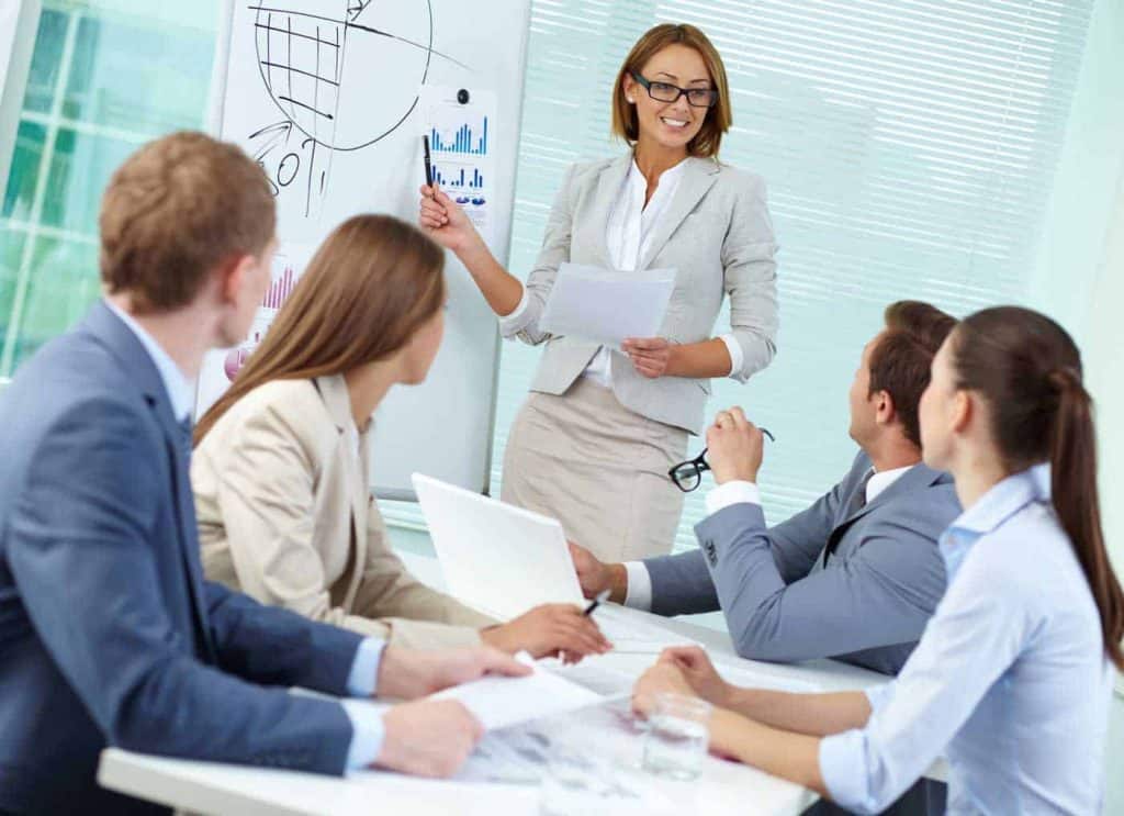 woman discussing financial outlook with team