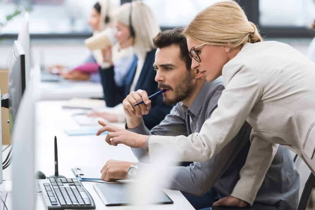 woman leader teaching coworkers