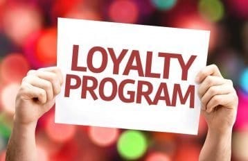 person holding loyalty marketing card