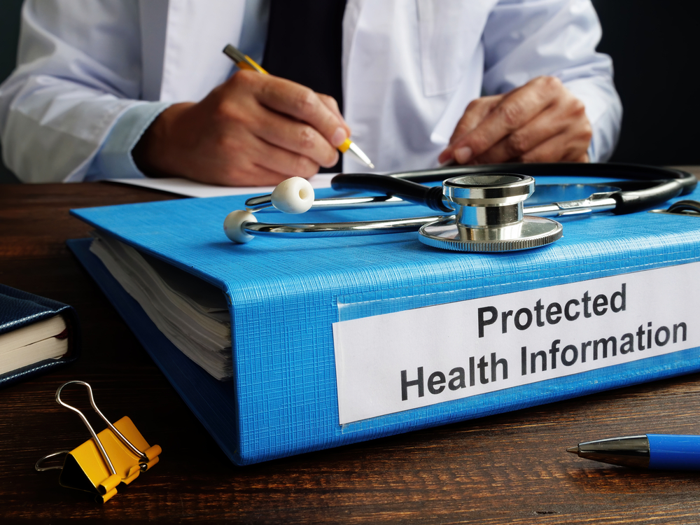 A healthcare professional writing protected health information for content marketing.