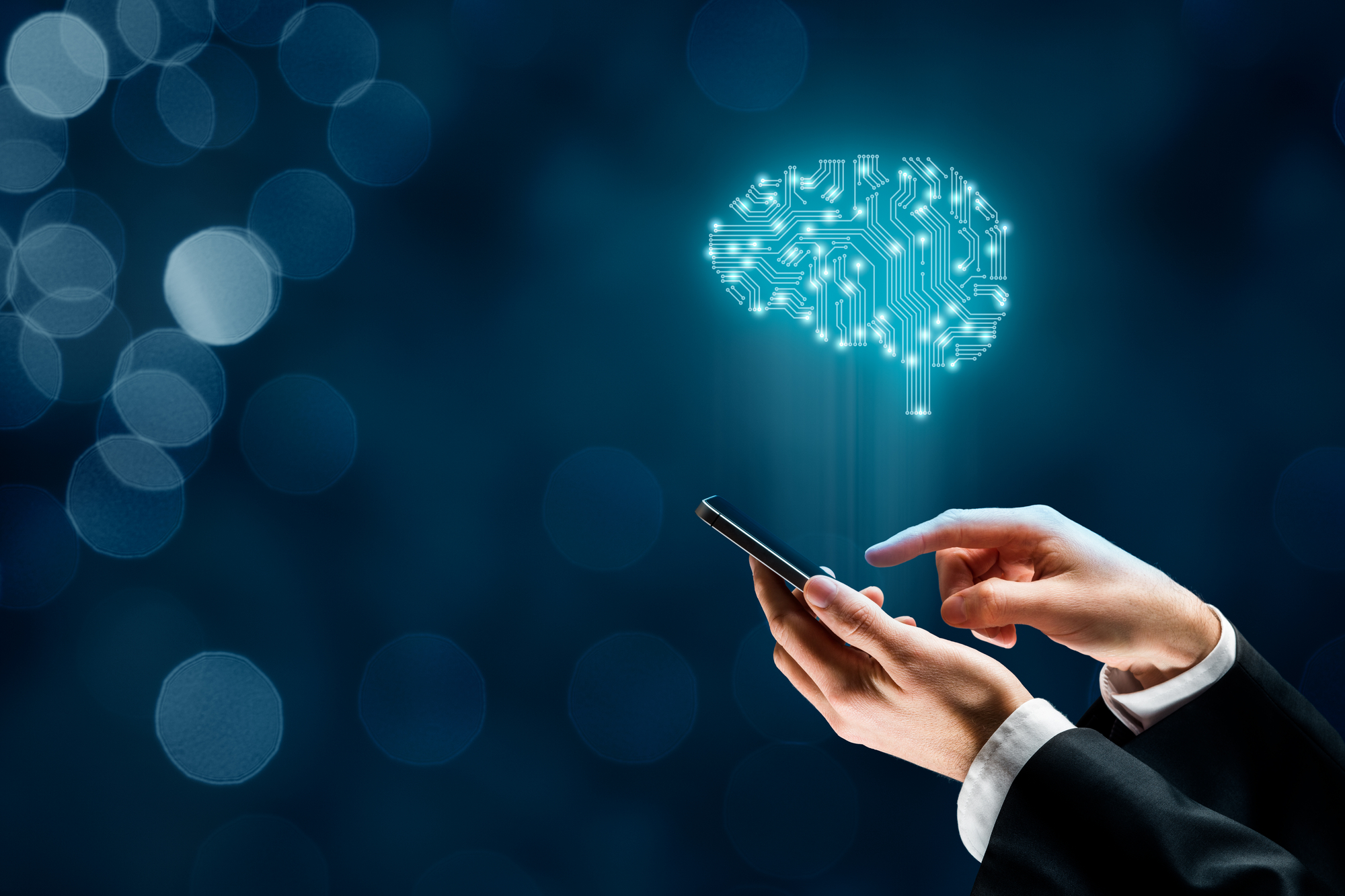 Businessperson using a smartphone with a digital illustration of a circuit board brain above it, symbolizing artificial intelligence or smart technology concepts.