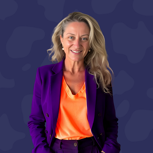 Woman wearing a purple suit and orange blouse stands smiling against a dark blue patterned background, embodying the confidence and professionalism found in go high level Australia.